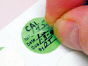 Circular calibration labels have a self-laminating flap.